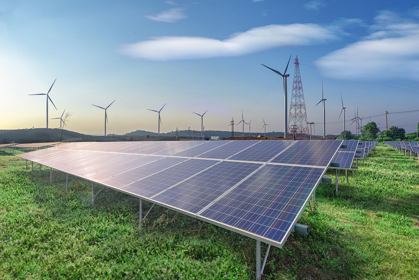 renewable-energy-solar-panels-wind-turbines-green-grass-blue-sky renewable-energy-solar-panels-wind-turbines-green-grass-blue-sky